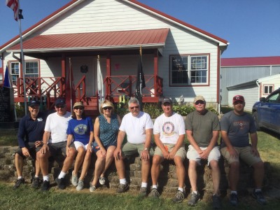 Photo taken in front of the library and WWII Veterans Memorial, Left to right: Bill Weyers, Grimes, IA; Jim and Kathleen Schreier, Fort Dodge, IA; Karen and Miles Bowen, Brighton, MI; Steve McGreevy - Poplar Grove, Illinois; George Lohmeier, Indianapolis, IN; Doug States, Geneseo, IL