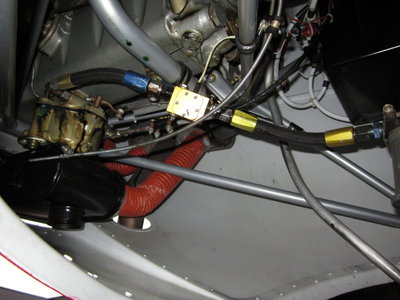 Fuel line routing with fuel flow transducer installed